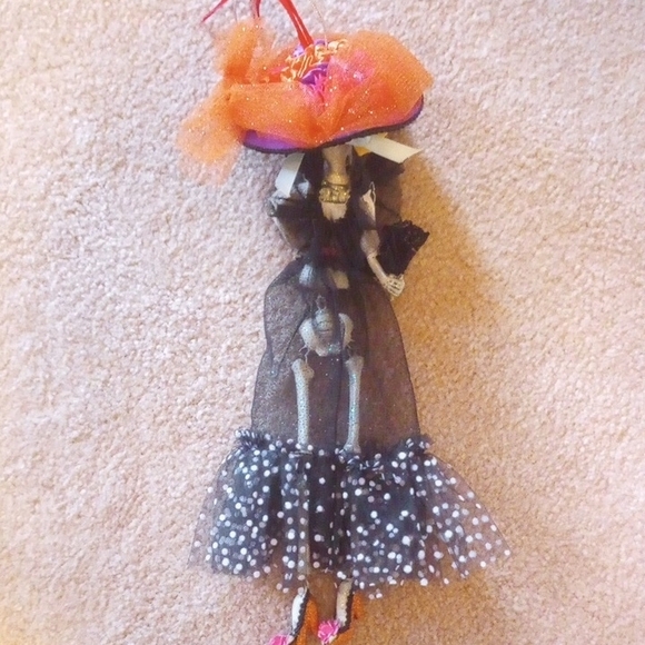 Elegant Black Skeleton Figurine with Orange and Yellow And Pink Accents - Picture 5 of 10